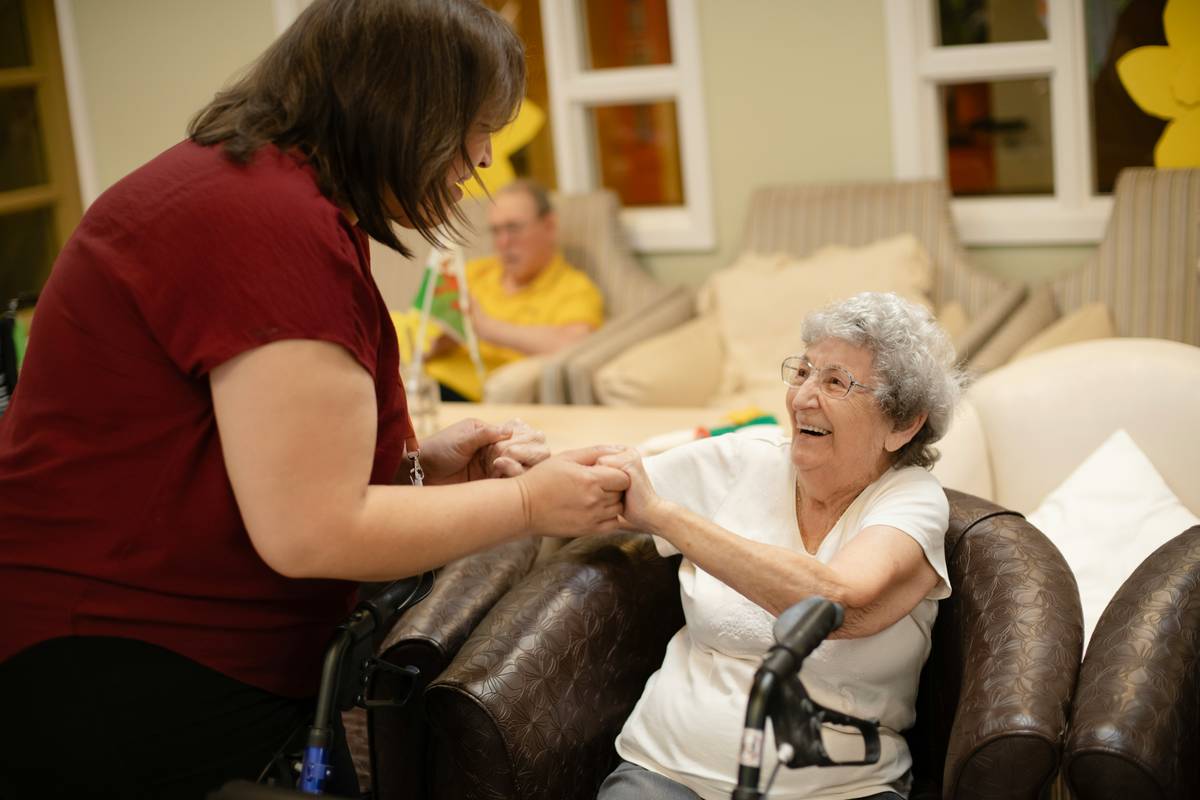 Family reviewing Nursing Home Benefits options with financial advisor