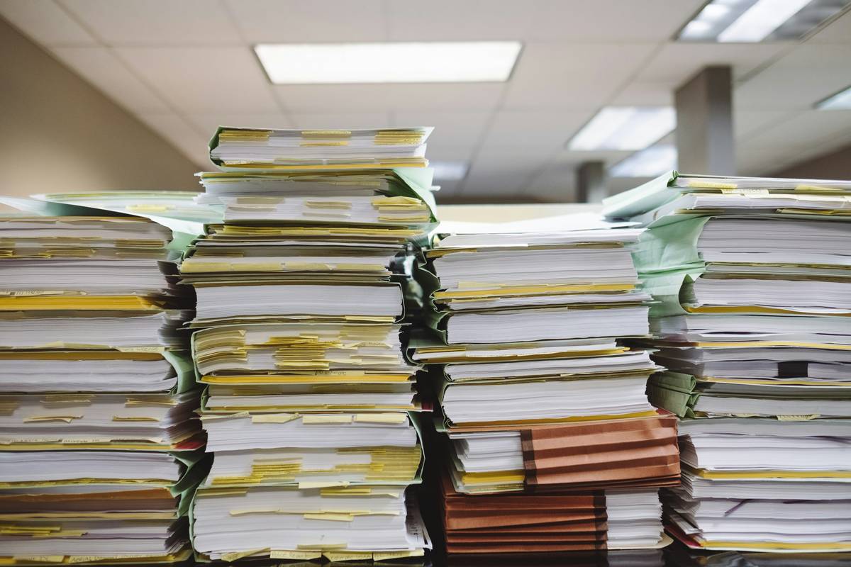Senior reviewing Filing a Claim Checklist with family member during long-term care insurance claim process